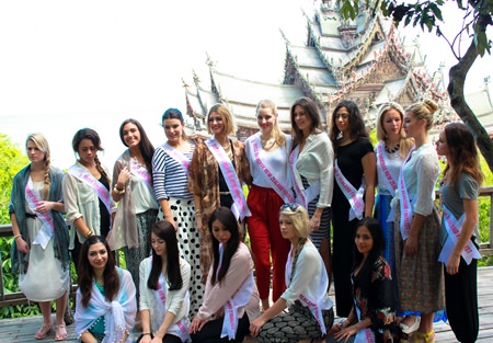Sixteen of the 25 Miss New Zealand contestants touring Pattaya pose for a photo in front of the Sanctuary of Truth.