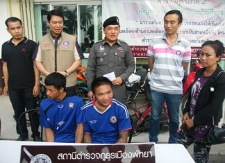 Sutin “Joke” Srisook (seated right) and cohort Patcharapong Uam-urb have been arrested for theft.