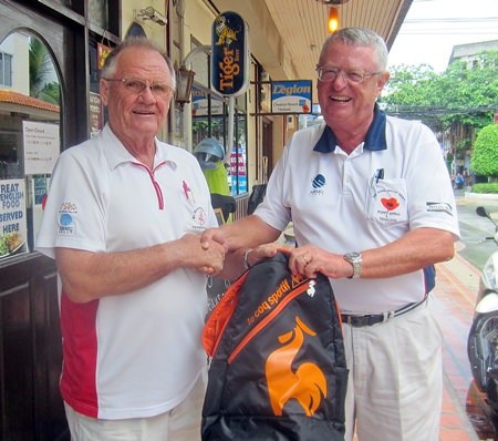 Derek Brook (left) presents the MBMG Golfer of the Month award to Dick Warberg.