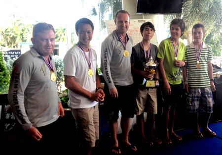 The victorious ‘Easy Tiger’ crew pose with the Platu National Championship trophy at Ocean Marina Yacht Club, Sunday, August 17.