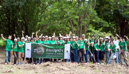Raimon Land employees led by Nuch Kalyawongsa, Director and Chief Financial Officer, pose at Baan Sap Tai while taking part in a joint reforestation project with the Plant A Tree Today Foundation (PATT).