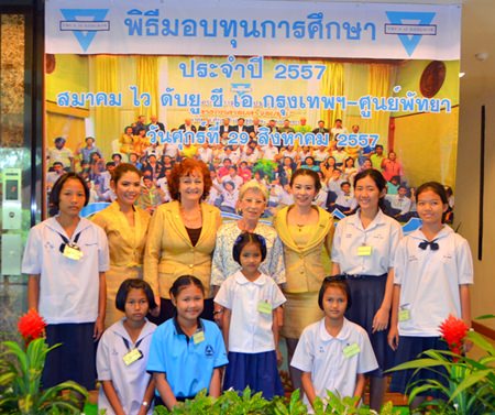 Bangkok-Pattaya YWCA president, Praichit Jetpai (3rd right), poses with benefactors and a few of the scholarship students at the YWCA’s Warm Family project at Diana Garden and Resort Pattaya.