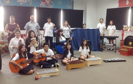 St. Andrew students and teachers work collaboratively on their music compositions.
