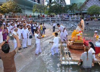Followers of the Hindu and Buddhist god Ganesha prepare to lower a statue of the “god of success” into the sea at Bali Hai Pier.