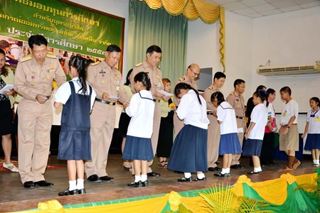 Officers at Sattahip Naval Base recently handed out 621,000 baht in scholarships to families of navy personnel.