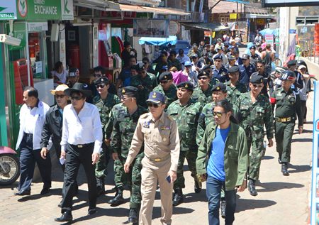 An entourage of government officials, military and local police make their way to inspect Koh Larn’s beaches.