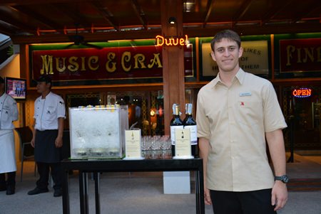 Santiago Bonet, Assistant F&B Manager of Pattaya Marriot Resort & Spa shows off a set of wine bottles.