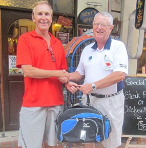 Dick Warberg (right) presents the MBMG golfer of the month award to Doug Maiko.