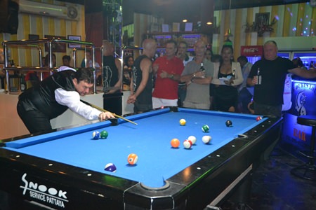 Jimmy White plays for the side pocket in one of his many charity games played last week to raise money for the Father Ray Foundation.