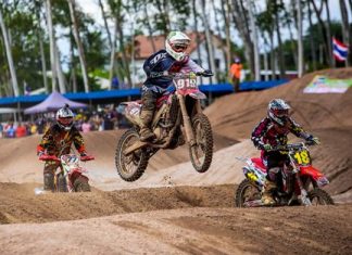 Motocross racers in the national MX 2 Open category kick up the dirt and take to the air.