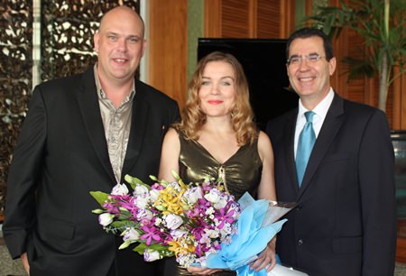 Antonello Passa (right) GM of the Royal Cliff Hotels Group presents a bouquet to Larisa and Marcus.