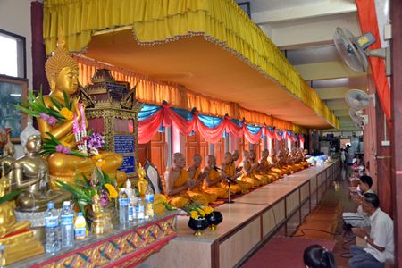 Over 20 monks from Bunsamphan temple wish luck upon the citizens attending the merit making ceremony at the end of Buddhist Lent.
