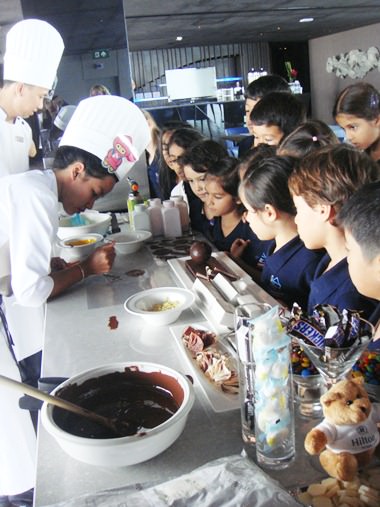 Learning how to decorate with chocolate.