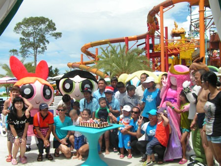 A huge chocolate cake was presented to the children in celebration of their special day.