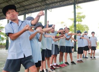 Primary students make the perfect colon for Punctuation Day.