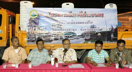 Nongprue Mayor Mai Chaiyanit (center) chairs a public forum to publicize community-development projects.