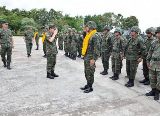 Rear Adm. Luechai Ruddit sends off troops to the south, wishing them the best and to come back safely.