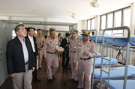 Education Minister Narong Phipatanasai inspects the barracks where college students will be interned for a month-long camp aimed at teaching them discipline, morals and ethics.