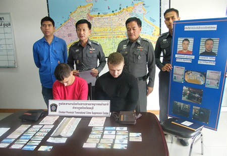 Evgenii Kurbatov (left) and Sergei Popov (right) were apprehended with 36 fake ATM cards and cash.