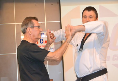 Scott Rohr is assisted by Jim Jones in demonstrating some martial arts characteristics.
