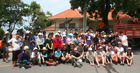 The cleaning crew takes a break after a hard day’s work picking up trash, discarded by inconsiderate people, around Pratamnak Hill.