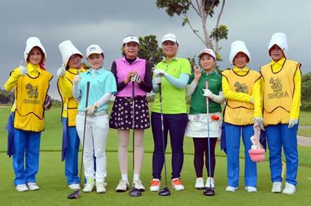 Female golfers line up at the Singha Amazing International Caddy Championship 2014 held at Siam Country Club in Pattaya on Oct. 6.