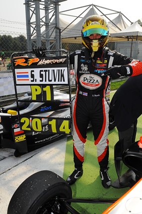 Thai racer Sandy Stuvik celebrates in the pit lane after securing the 2014 EuroFormula Open championship title.