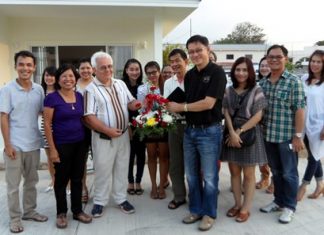 Achim von Geiso poses with friends in front of the two show homes.