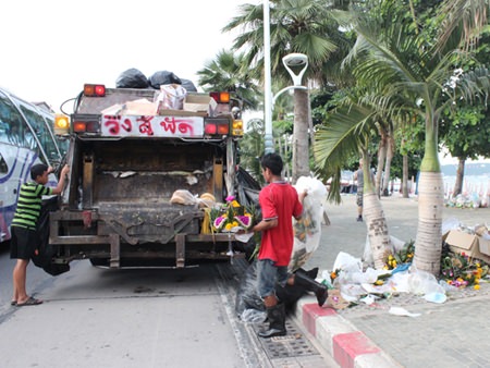 There is always a morning after - staff from the office of Public Health and Environment clean leftover materials used in making krathongs.