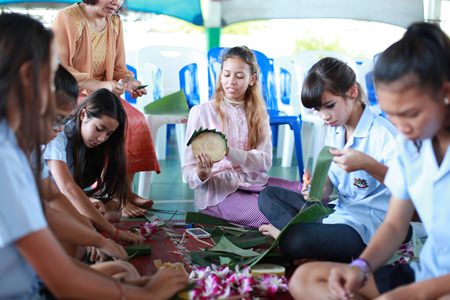 Secondary students from GIS have fun making their krathong.