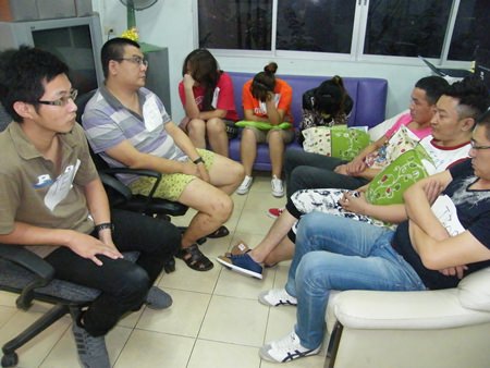 8 of the 9 ethnic Chinese who were arrested in Chonburi following a raid of a telephone-scam call center.