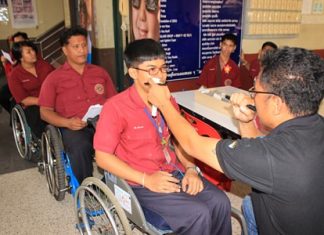 Opticians from the Essilor Vision Foundation make eye-glasses for the 300 Redemptorist students with eye problems.