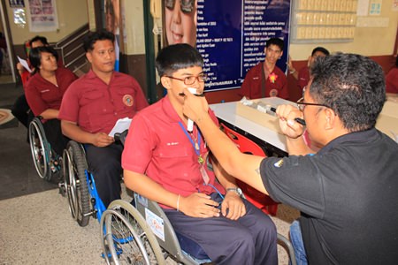 Opticians from the Essilor Vision Foundation make eye-glasses for the 300 Redemptorist students with eye problems.