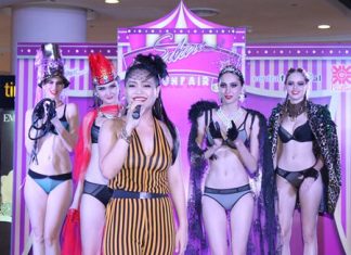 Vocalist Wanlika (Taengmo) Kertsawapitak performs for the crowd as lingerie models look on.