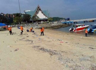 City workers from Pattaya’s Environmental Department clean the beach near Bali Hai Pier and Siam Bayshore.