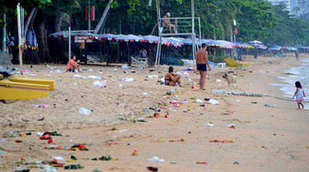 Jomtien Beach was littered with floats, balloons, discarded bottles, bags and food containers left behind by revelers.