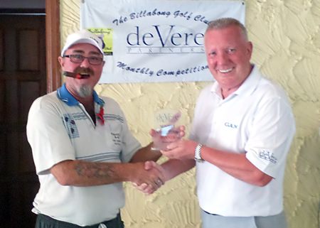 Owen Walkley receives the deVere trophy for October from Brian Chapman.