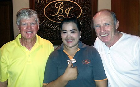 Bill McGarvie (left) and Jim Ferris (right) celebrate with one of the BJ’s Holiday Lodge helpers.