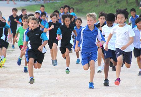 St Andrews student Ben Harcourt-Harrison (centre-right) leads the pack from start to finish in the boys under 11 race.