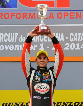 Thai racer Sandy Stuvik stands atop the podium after winning the Spanish Formula 3 race at the Barcelona racetrack in Spain, Saturday, November 1.