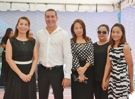 Matrix Managing Director Miki Haim (2nd left) poses with staff members and friends at the opening party for the City Center Residence showrooms on Dec. 11.