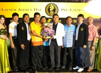 Bandit Siritanyok, CEO of 888 Villas (white jacket) is congratulated by members of Pattaya City council during the pre-launch agency day.