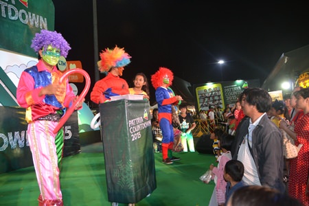 Clowns and superheroes entertain the crowds between concert performances.