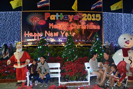 Families pose with Santa and Frosty in Central Pattaya.
