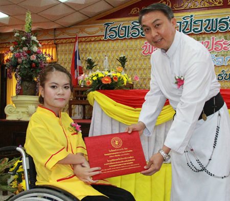 Father Peter presents the certificates.