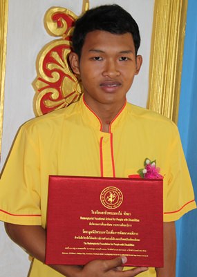 One of eight graduating electronic repair students.