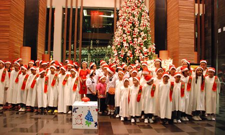 Young carolers prepare for their performance.