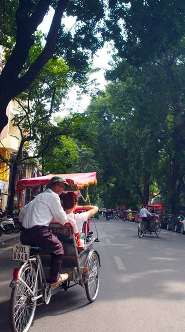 Students take a break on a rickshaw.