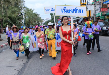 Kwangtung, aka Ms. Healthy Queen 2014, from the Sister Foundation, leads a group in the World AIDS Days parade.