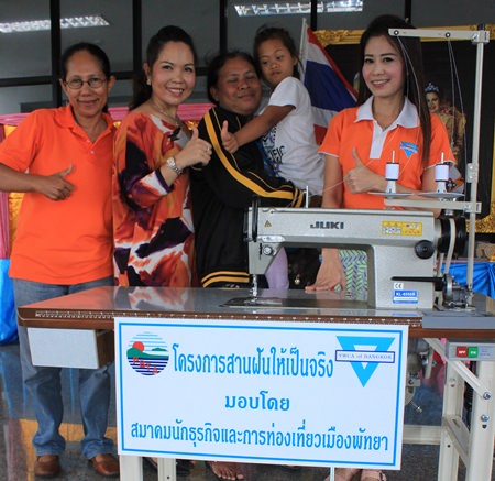 Pemika Sangsua’s mother is ecstatic to receive a sewing machine as part of the YWCA’s “Making Dreams Come True” project so she can earn an income at home whilst taking care of her disabled child.